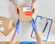 Hands on a returns box